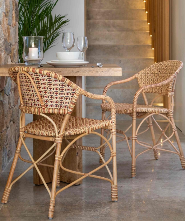 Brucs natural rattan chairs and armchairs in a restaurant bistro setting